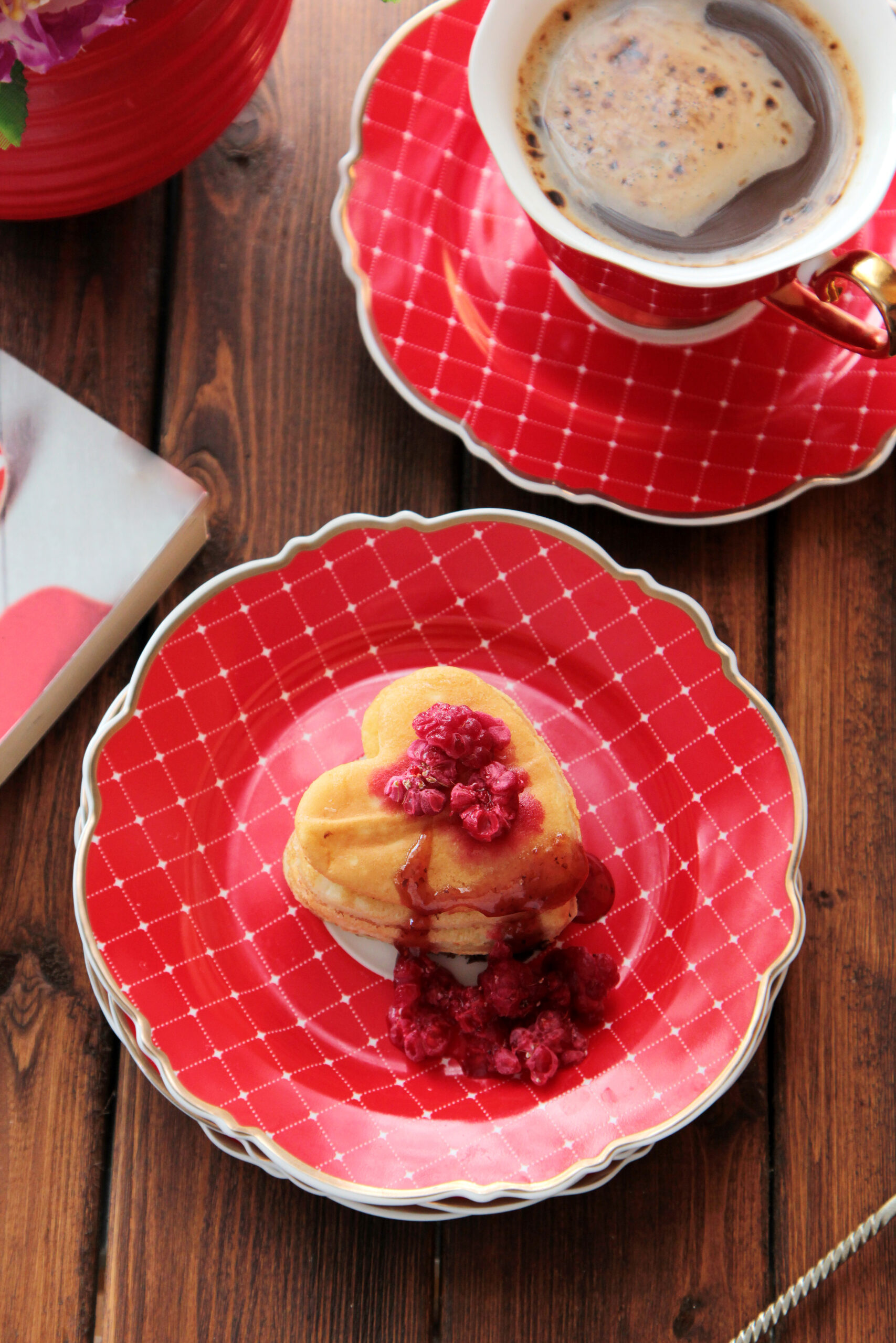 top view cookies in the shape of a heart with raspberries with a cup of coffee top view cookies in the shape of a heart with raspberries with a cup of coffee